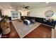 Comfortable living room featuring hardwood floors, modern furniture, and stylish decor at 1742 W Butler Dr, Phoenix, AZ 85021