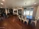 Inviting living room with a dark wood dining table, and a built-in brick fireplace at 1742 W Butler Dr, Phoenix, AZ 85021