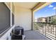 Cozy outdoor balcony with a table and chairs, perfect for relaxing and enjoying scenic community views at 17850 N 68Th St # 1017, Phoenix, AZ 85054