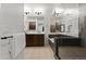 Luxurious bathroom featuring a soaking tub, glass-enclosed shower, and dual vanity at 17850 N 68Th St # 1017, Phoenix, AZ 85054