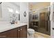 Bathroom with vanity, tile shower, fixtures, and mirror providing a clean and modern aesthetic at 17850 N 68Th St # 1017, Phoenix, AZ 85054