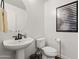 Clean half bathroom with a round mirror, modern sink and toilet, ideal for guests at 17850 N 68Th St # 1017, Phoenix, AZ 85054