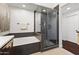 Luxurious bathroom featuring a soaking tub, glass-enclosed shower, and modern fixtures at 17850 N 68Th St # 1017, Phoenix, AZ 85054