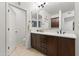 Spacious bathroom featuring a double vanity with dark wood cabinets and ample counter space at 17850 N 68Th St # 1017, Phoenix, AZ 85054