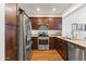 Well-equipped kitchen with stainless steel appliances, wood cabinets, and a functional layout at 17850 N 68Th St # 1017, Phoenix, AZ 85054
