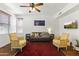 Comfortable living room with a ceiling fan, neutral walls, and a colorful rug at 17850 N 68Th St # 1017, Phoenix, AZ 85054