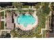 Overhead aerial of the community pool, with surrounding palm trees and lounge areas, ideal for leisure at 17850 N 68Th St # 1017, Phoenix, AZ 85054