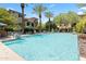 Inviting community pool area surrounded by lush landscaping and comfortable lounge chairs at 17850 N 68Th St # 1017, Phoenix, AZ 85054