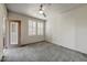 This bright bedroom has a ceiling fan, plush carpet, and access to outdoor balcony at 20100 N 78Th Pl # 2019, Scottsdale, AZ 85255