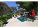 Community hot tub surrounded by lush greenery, mature trees, and lounge chairs at 20100 N 78Th Pl # 2019, Scottsdale, AZ 85255
