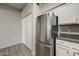 Kitchen featuring stainless steel refrigerator, granite counters and view into the main area at 20100 N 78Th Pl # 2019, Scottsdale, AZ 85255