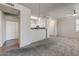 Neutral living space with bar, ceiling fan and views into the kitchen and bedrooms at 20100 N 78Th Pl # 2019, Scottsdale, AZ 85255