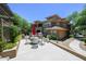 Outdoor patio with seating, grill, and lush landscaping for entertaining or relaxing at 20100 N 78Th Pl # 2019, Scottsdale, AZ 85255