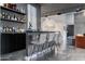 Elegant bar area with a sleek countertop, stylish seating, open shelving, and polished concrete floors at 2215 N 38Th Way, Phoenix, AZ 85008