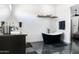 Modern bathroom showcases a freestanding tub, vanity, and sleek fixtures at 2215 N 38Th Way, Phoenix, AZ 85008