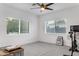 Spacious bedroom with two windows and a ceiling fan at 2215 N 38Th Way, Phoenix, AZ 85008