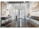 Bright entrance features modern cabinets on gray, glossy floors and art pieces at 2215 N 38Th Way, Phoenix, AZ 85008