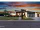 Stunning modern home featuring unique architectural details, wood accents, and a stylish three-car garage at 2215 N 38Th Way, Phoenix, AZ 85008