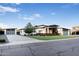 Charming modern home featuring unique architectural details, wood accents, and a stylish three-car garage at 2215 N 38Th Way, Phoenix, AZ 85008
