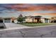 Beautiful modern home featuring unique architectural details, wood accents, and a stylish three-car garage at 2215 N 38Th Way, Phoenix, AZ 85008