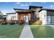 Charming modern home with wood accents, manicured landscaping, and a welcoming entrance at 2215 N 38Th Way, Phoenix, AZ 85008