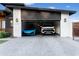 Attached garage with two luxury vehicles at 2215 N 38Th Way, Phoenix, AZ 85008