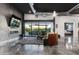 Stunning living room with a fireplace, large glass doors leading to the backyard, and sleek polished floors at 2215 N 38Th Way, Phoenix, AZ 85008