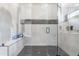 Glass enclosed shower features white tiling and black showerhead at 2215 N 38Th Way, Phoenix, AZ 85008