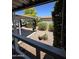 View of the backyard featuring lush trees and plants, offering a private and serene outdoor space at 2233 E Behrend Dr # 121, Phoenix, AZ 85024