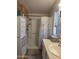 Bright bathroom features a shower and a storage unit at 2233 E Behrend Dr # 121, Phoenix, AZ 85024