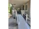 Exterior view of the home featuring a wheelchair ramp, covered porch, and patio seating area at 2233 E Behrend Dr # 121, Phoenix, AZ 85024