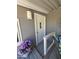 Close-up of the home's front door, with covered porch, decor, and privacy at 2233 E Behrend Dr # 121, Phoenix, AZ 85024