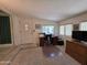 Comfortable room with desk, front door, and large windows at 2233 E Behrend Dr # 121, Phoenix, AZ 85024
