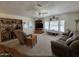 Spacious living room featuring plush seating, entertainment center, and plenty of natural light at 2233 E Behrend Dr # 121, Phoenix, AZ 85024