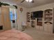 Relaxing main bedroom featuring an entertainment center and access to an en-suite bathroom at 2233 E Behrend Dr # 121, Phoenix, AZ 85024