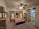 Inviting main bedroom features a ceiling fan, plush carpeting, and an en-suite bathroom at 2233 E Behrend Dr # 121, Phoenix, AZ 85024