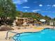This is a pool with a rock waterfall for a serene view at 2233 E Behrend Dr # 121, Phoenix, AZ 85024
