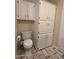 Bathroom featuring a toilet with linen cabinets at 2233 E Behrend Dr # 17, Phoenix, AZ 85024