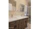 The bathroom features double sinks with granite counters and a beautifully tiled walk-in shower at 2233 E Behrend Dr # 17, Phoenix, AZ 85024