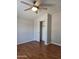 Bedroom features brown flooring, closet, and gray walls creating a bright, comfortable atmosphere at 2233 E Behrend Dr # 17, Phoenix, AZ 85024