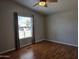 Bedroom features brown flooring, a window, and gray walls creating a bright, comfortable atmosphere at 2233 E Behrend Dr # 17, Phoenix, AZ 85024