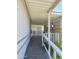 Covered porch, with railing, providing access to the home at 2233 E Behrend Dr # 17, Phoenix, AZ 85024