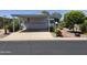 Charming mobile home features a covered carport and beautifully landscaped surroundings at 2233 E Behrend Dr # 17, Phoenix, AZ 85024