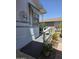 A wooden ramp leads to a shaded porch with potted plants at 2233 E Behrend Dr # 17, Phoenix, AZ 85024