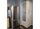 This kitchen features stainless steel refrigerator and custom white storage cabinet with mounted pegboard at 2233 E Behrend Dr # 17, Phoenix, AZ 85024