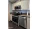 Modern kitchen with stainless steel appliances and granite countertops at 2233 E Behrend Dr # 17, Phoenix, AZ 85024