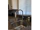 Stainless steel kitchen sink with granite countertop under bright window at 2233 E Behrend Dr # 17, Phoenix, AZ 85024