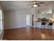 Open floor plan with wood floors, leading to kitchen with bar seating at 2233 E Behrend Dr # 17, Phoenix, AZ 85024