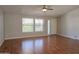 Bright living room boasts wood floors, ceiling fan and natural light at 2233 E Behrend Dr # 17, Phoenix, AZ 85024