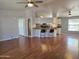 Spacious area with wood floors offers access to the kitchen and bedrooms at 2233 E Behrend Dr # 17, Phoenix, AZ 85024